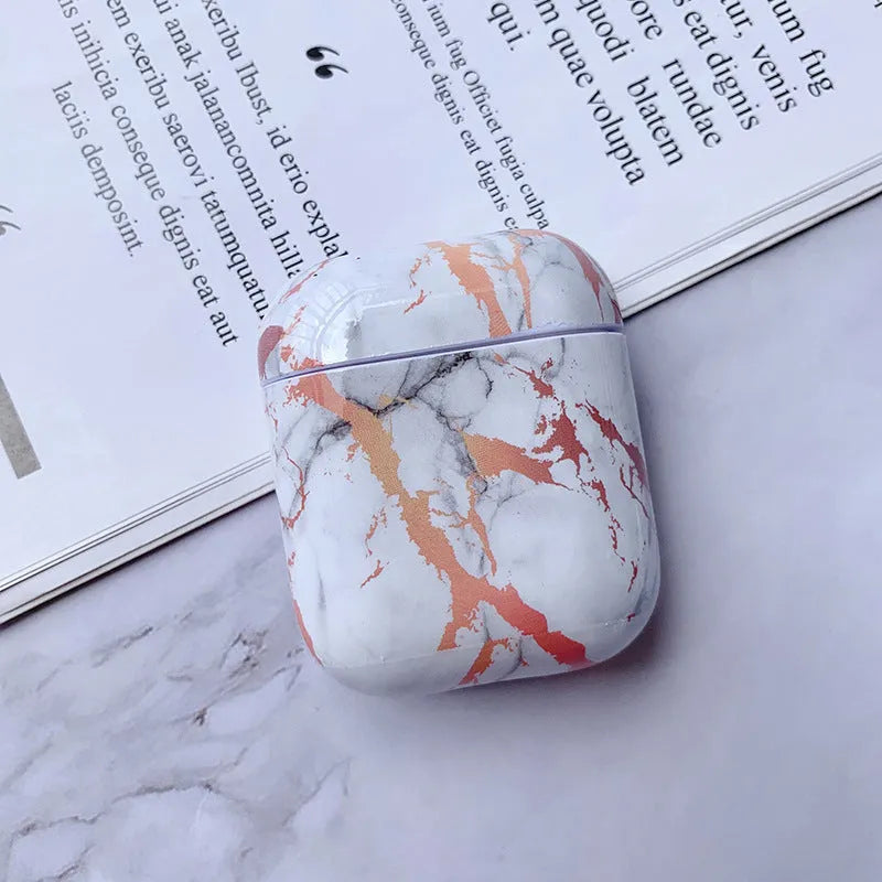 White marble protective case for Apple AirPods charging box showing hard PC construction