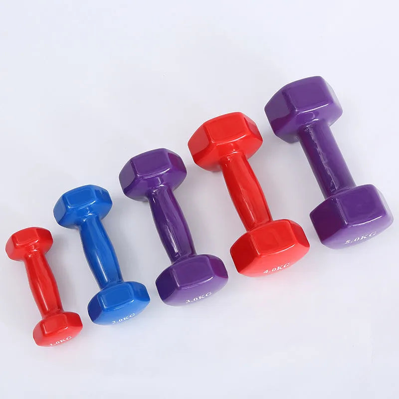 Bright coloured plastic fitness dumbbells with glossy surface for yoga and aerobics