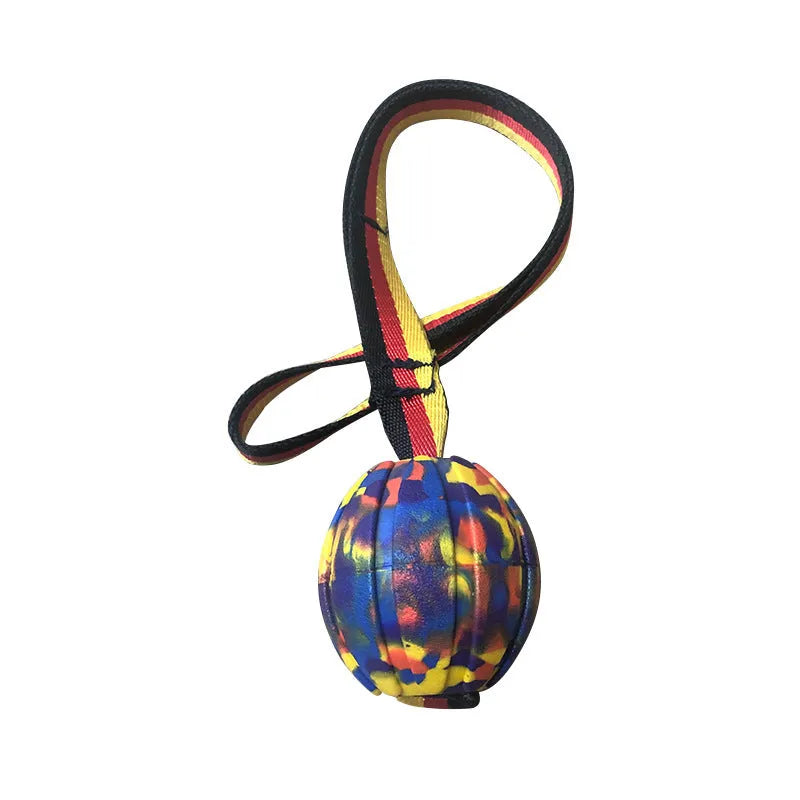 Camouflage and yellow EVA foam floating dog training balls in three different sizes on a blue background.