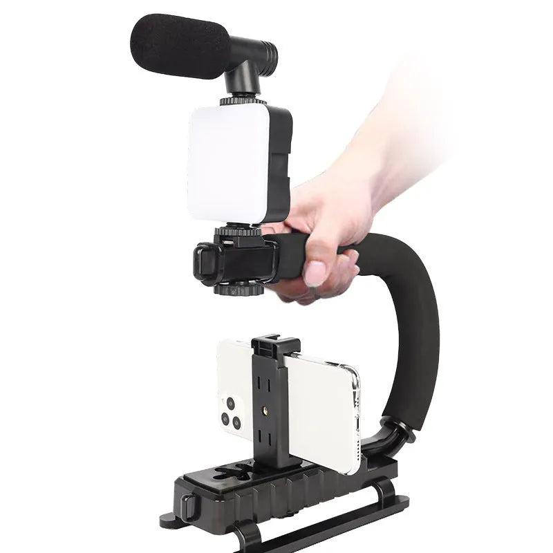 Mini square outdoor camera flash on a small tripod with a rotatable head