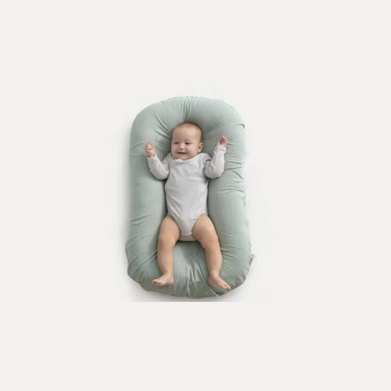 Beige portable cotton baby nest crib cushion measuring 75cm by 45cm for infant sleep.