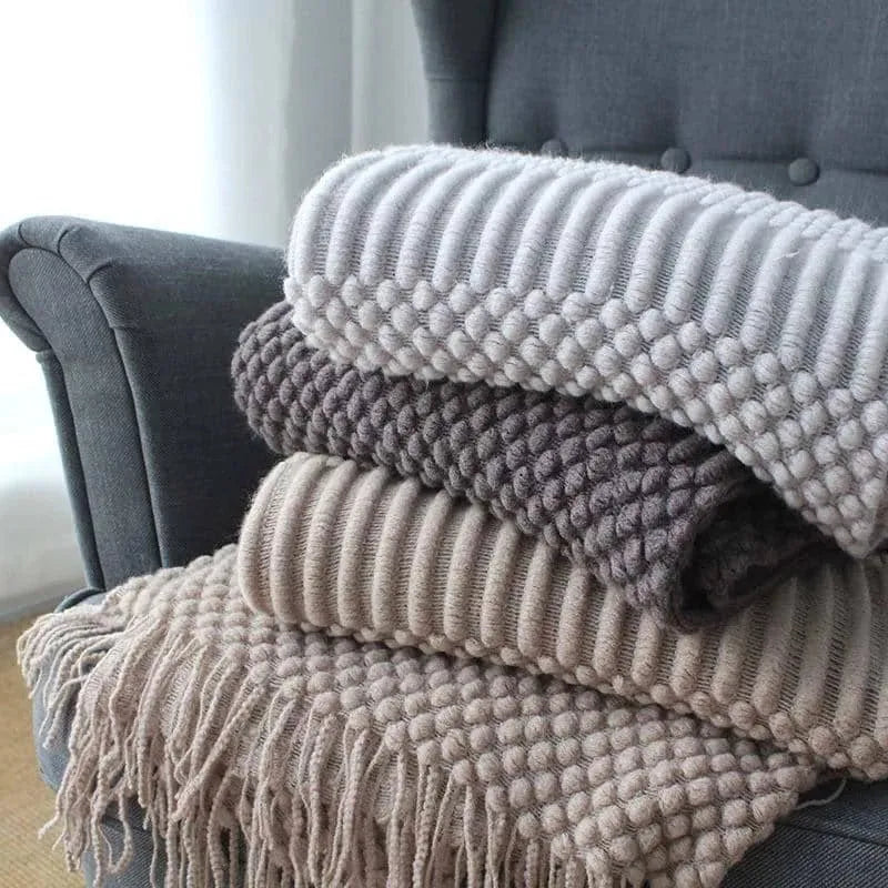 Small light grey polyester nap blanket folded, showing its 127x170cm size.