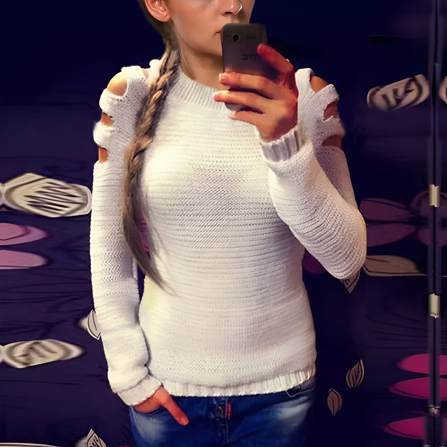 Women's grey crocheted hollow-out long-sleeved shirt with a round neck on a hanger