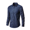 Men's loose-fit long-sleeve linen shirt shown in a neutral colour, featuring a button front and long sleeves.