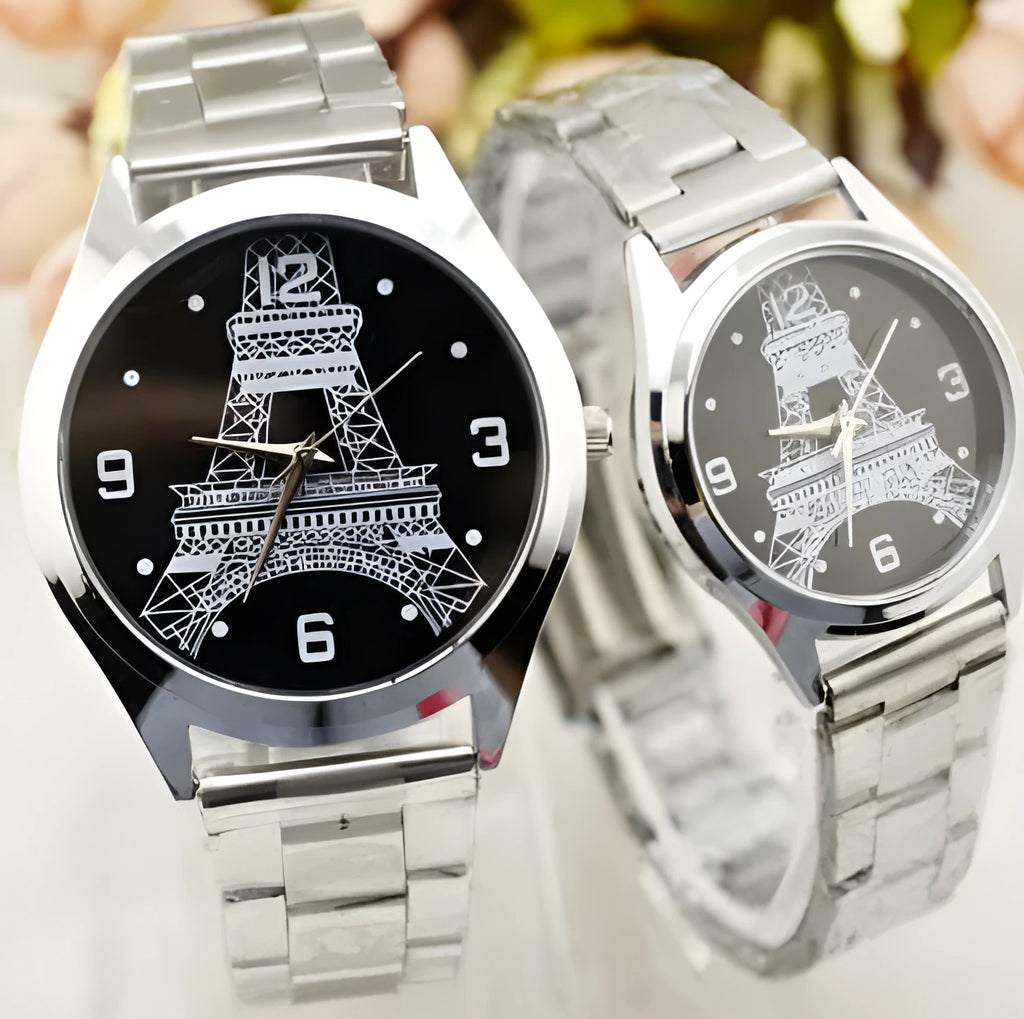 Black wrist watch with silver case and a dial featuring an Eiffel Tower design on a leather strap.