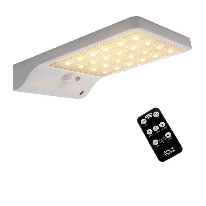 Outdoor solar garden light with LED illumination and waterproof IP65 rating in black or white finish