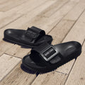 Women's grey blue flip-flop slippers with a buckle strap and soft EVA sole.