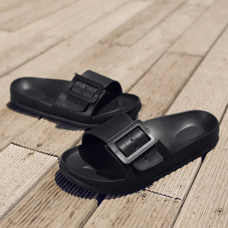 Women's grey blue flip-flop slippers with a buckle strap and soft EVA sole.