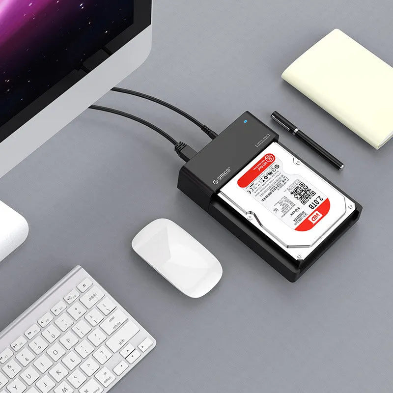 Black plastic hard disk enclosure for 2535-inch SATA drives with data cable