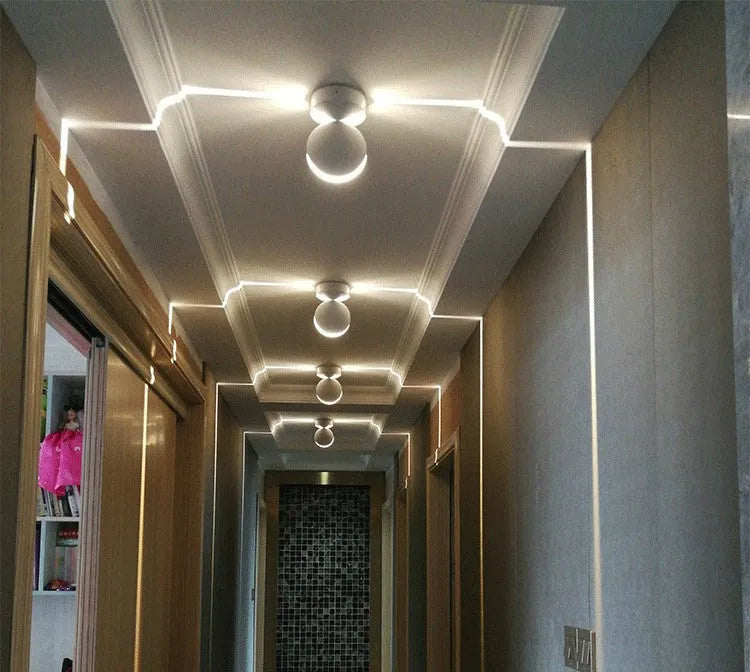 Modern aluminium and glass corridor wall lamp spotlight bar with LED lighting in one of five colour options.