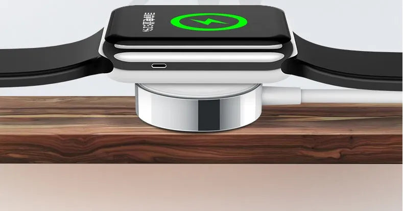 White metal Apple Watch wireless charger with 1m USB cable on a table