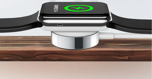 White metal Apple Watch wireless charger with 1m USB cable on a table