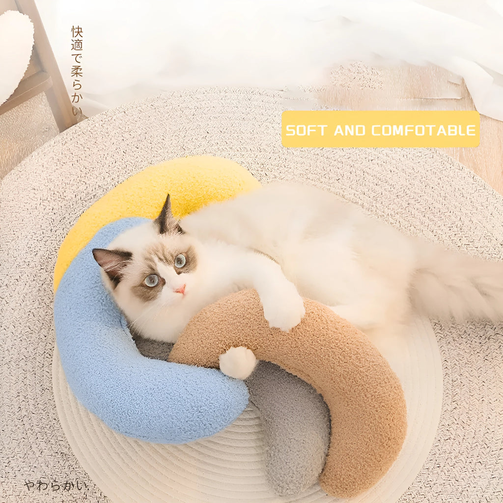 U-shaped blue cat pillow with adjustable collar for cervical support during feline sleep