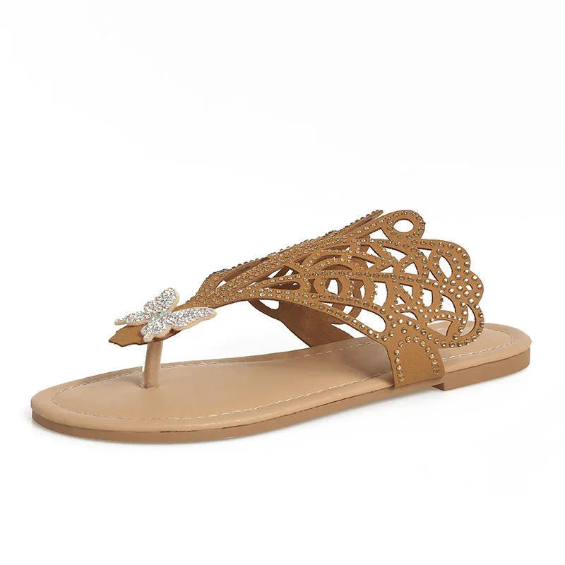 Women's black flip-toe sandals with rhinestone detailing and hollow design on flat rubber sole