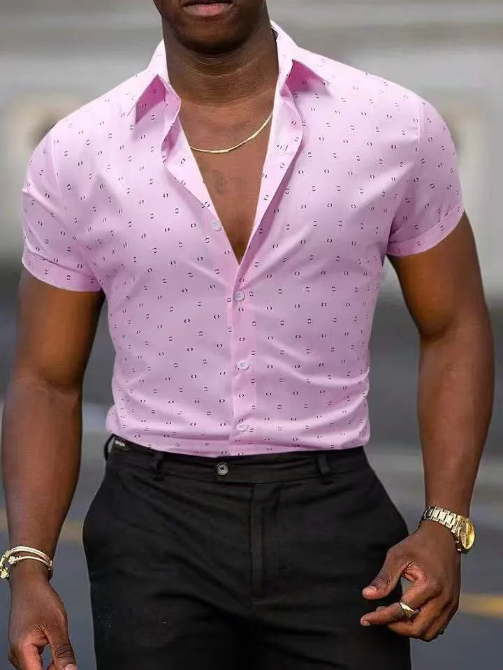 Man wearing light blue short-sleeved shirt with floral pattern, made from stretch polyester fabric