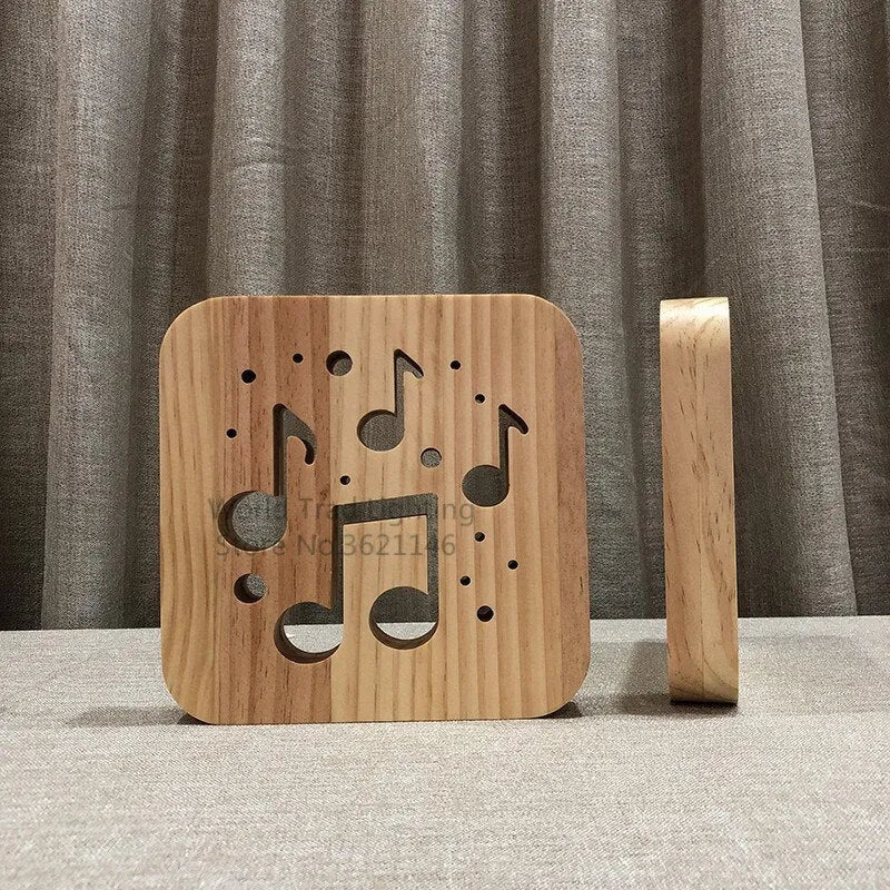 Square pine wood USB lamp emitting a warm white 3D patterned light on a surface.