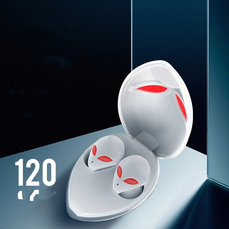 Creative Outer T8 Starman alien design wireless earbuds with LED lights next to charging case.