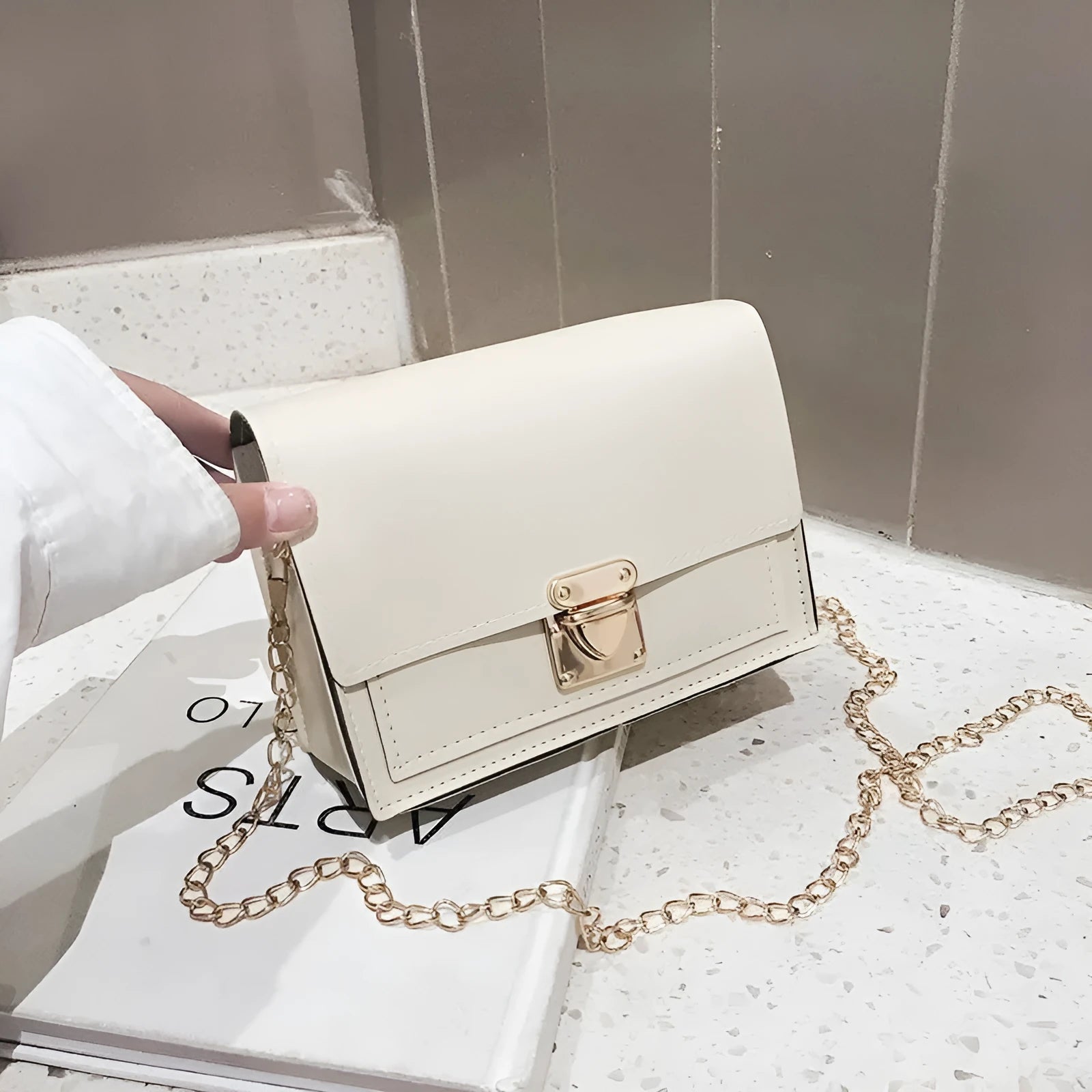 Women's PU leather small square messenger bag in beige with chain strap, 17x13x6cm.
