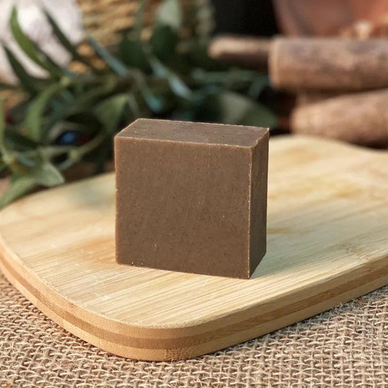 Single 72g bar of nine grass cold process shampoo soap on a white background.