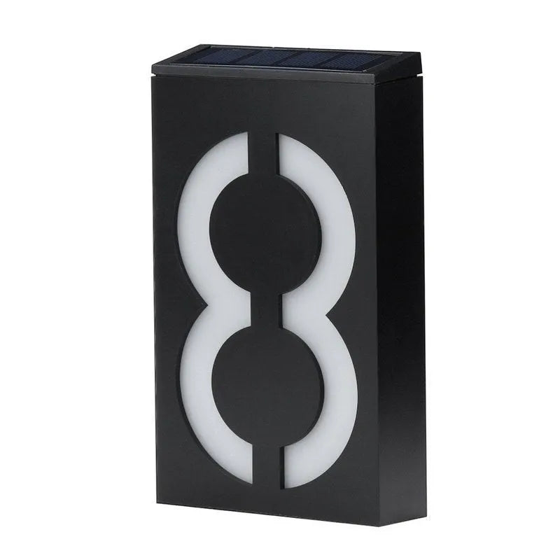 Solar powered house number light with white LEDs illuminating digit, IP65 waterproof outdoor design