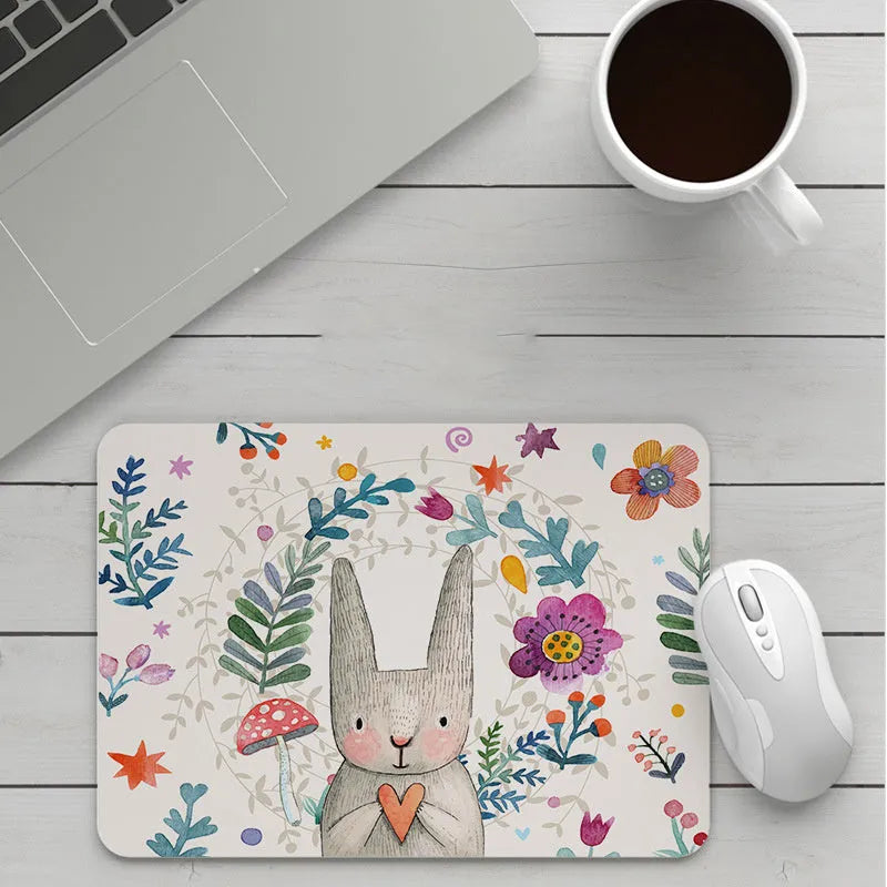 Custom cartoon mouse pad with thickening, showing example artwork on non-slip rubber and cloth base.