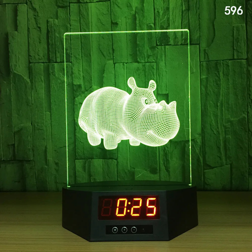 White 3D dolphin shaped night light with wireless charging base and remote control on a desk.