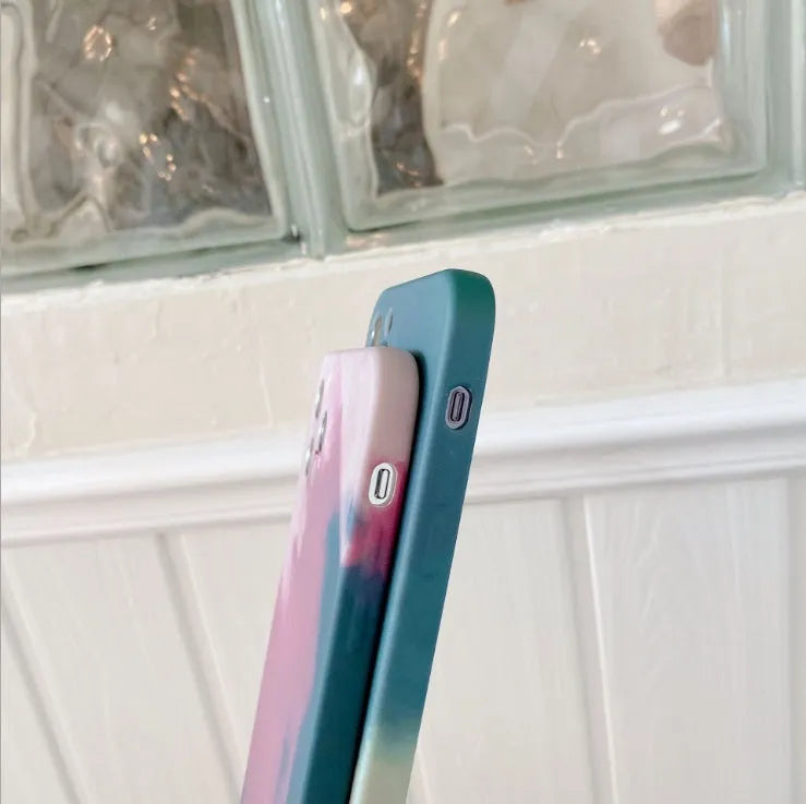 Soft silicone iPhone case with blue and purple oil painting gradient and white geometric abstract pattern.