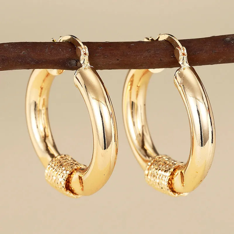 Geometric golden copper ear clip for women with ring and line design elements