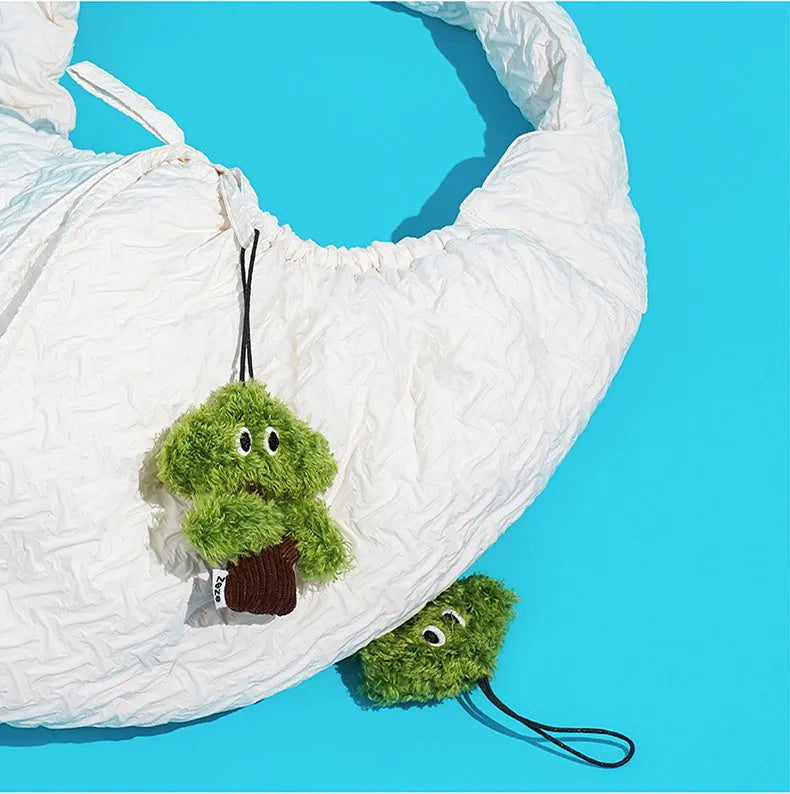 Pine tree shaped cat toy with bag pendant, showing small, medium, and large size options