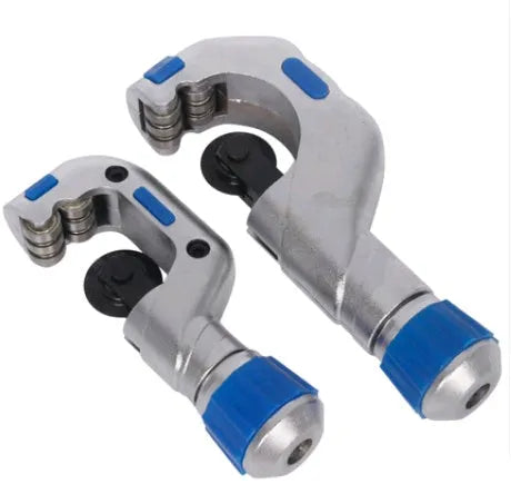 Stainless steel pipe cutter with single blade on a workbench, showing large size option for cutting copper pipes