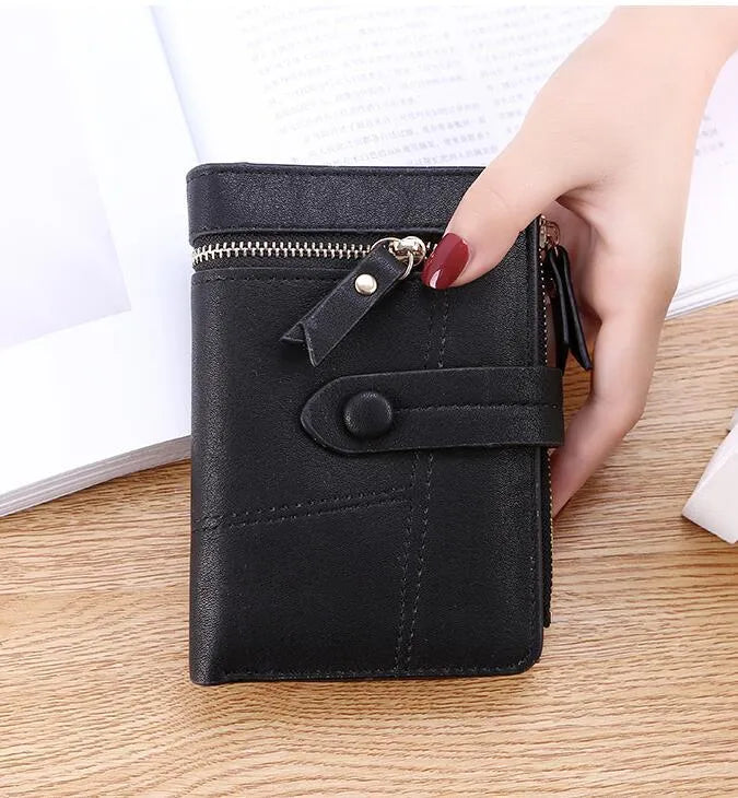 Faux leather standard short wallet with zipper closure, solid colour, showing multiple internal compartments