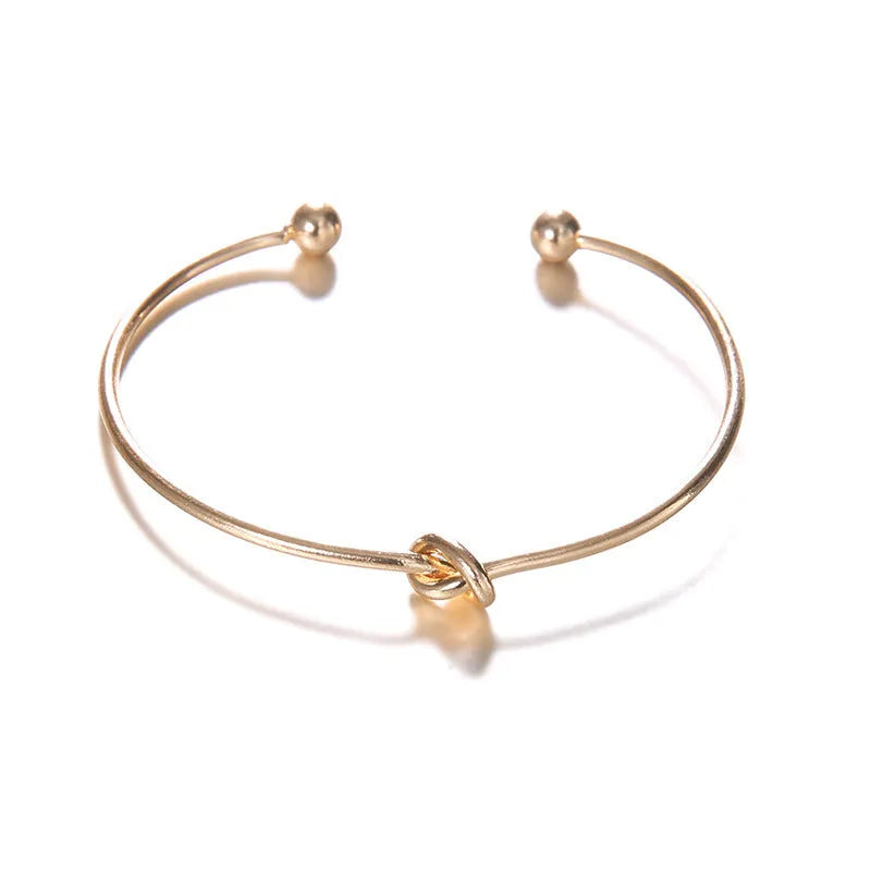 Women's gold electroplated alloy vintage cuff bracelet with knotted arrow design for European-American style jewellery