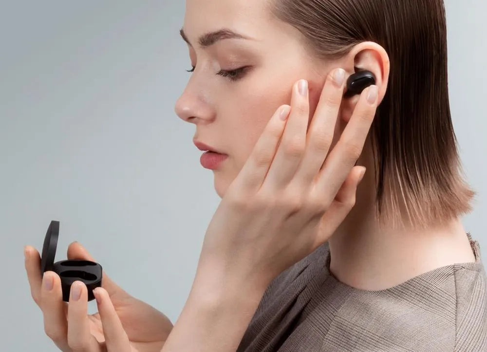 Black Redmi AirDots 2 true wireless earbuds and charging case on a white background