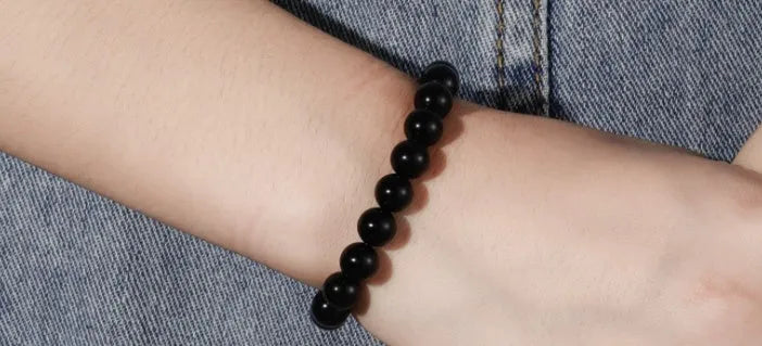Geometric black agate bead bracelet for women with 8mm stones on a stretch elastic cord.