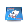 Retro NES game console with two controllers on television stand