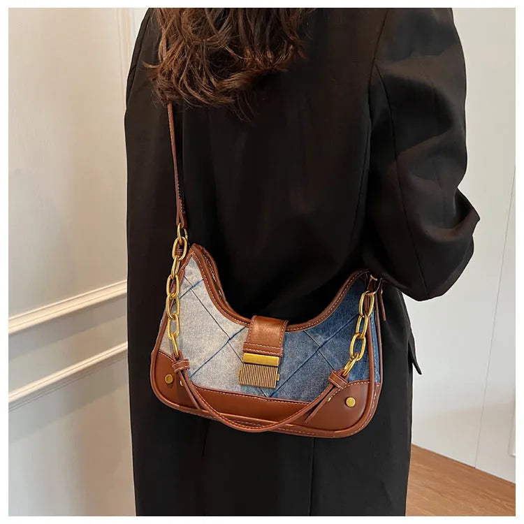 Brown denim bucket shoulder bag with diamond mesh pattern and chain decorative elements