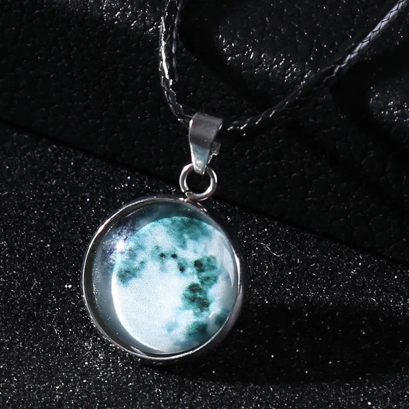 Luminous constellation pendant necklace with adjustable chain on a plain background.