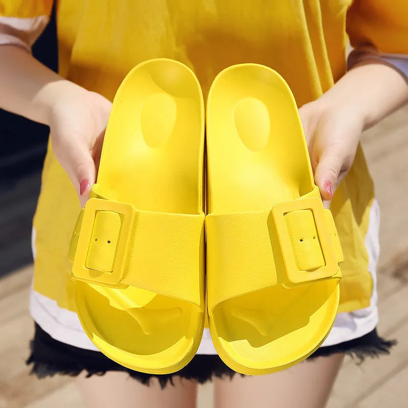 Women's grey blue flip-flop slippers with a buckle strap and soft EVA sole.