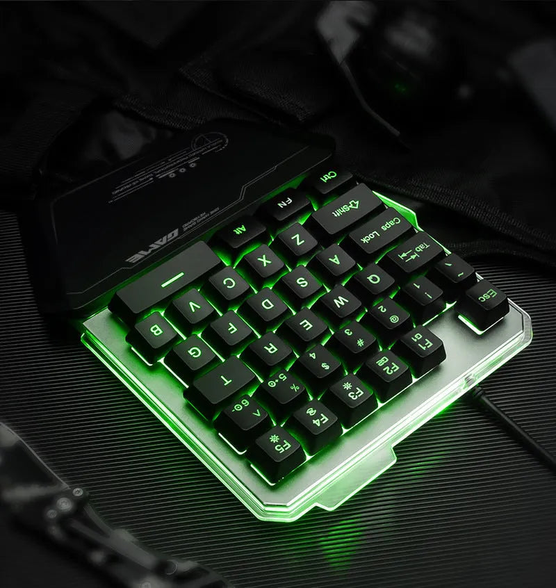 Black robotic one-handed G40 keyboard with RGB backlit keys on a desk.