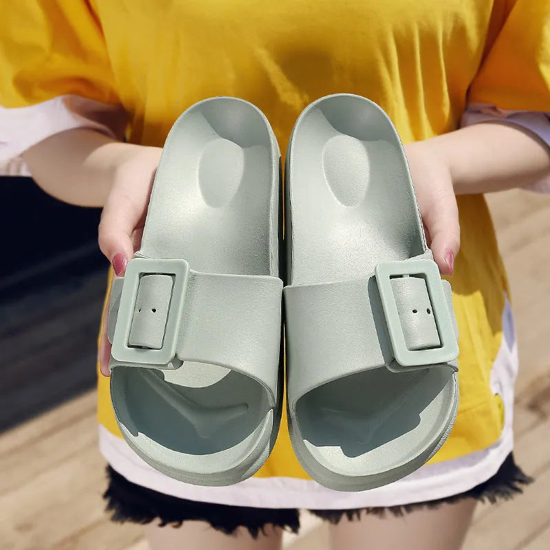 Women's grey blue flip-flop slippers with a buckle strap and soft EVA sole.