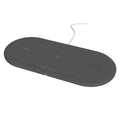 Black three-in-one wireless charging station for Apple iPhone iWatch and AirPods on a desk