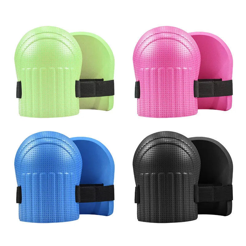 A pair of EVA foam kneepads in black, shown on a hard floor surface.