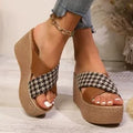 Cross leopard plaid pattern wedge sandals with a brown and black design and a rubber sole.