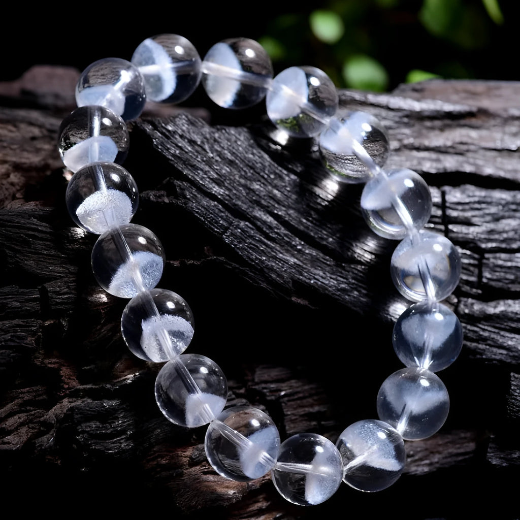 Women's white crystal ghost pyramid bracelet with ruyi symbol on wrist, showing adjustable bead sizes.