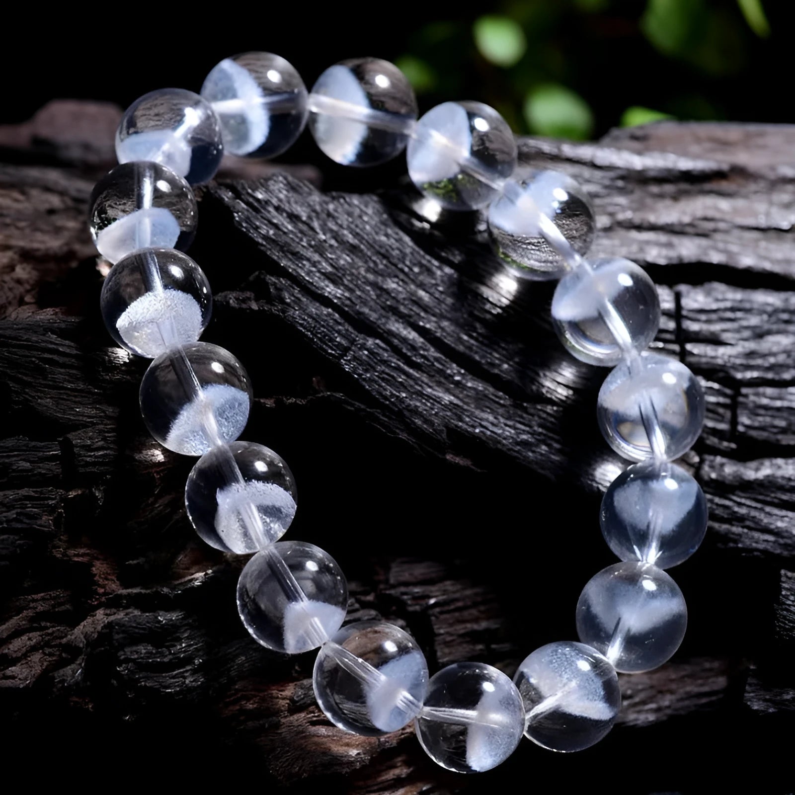 Women's white crystal ghost pyramid bracelet with ruyi symbol on wrist, showing adjustable bead sizes.
