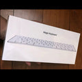 Apple white metal Bluetooth wireless keyboard with ultra-thin design and multimedia keys