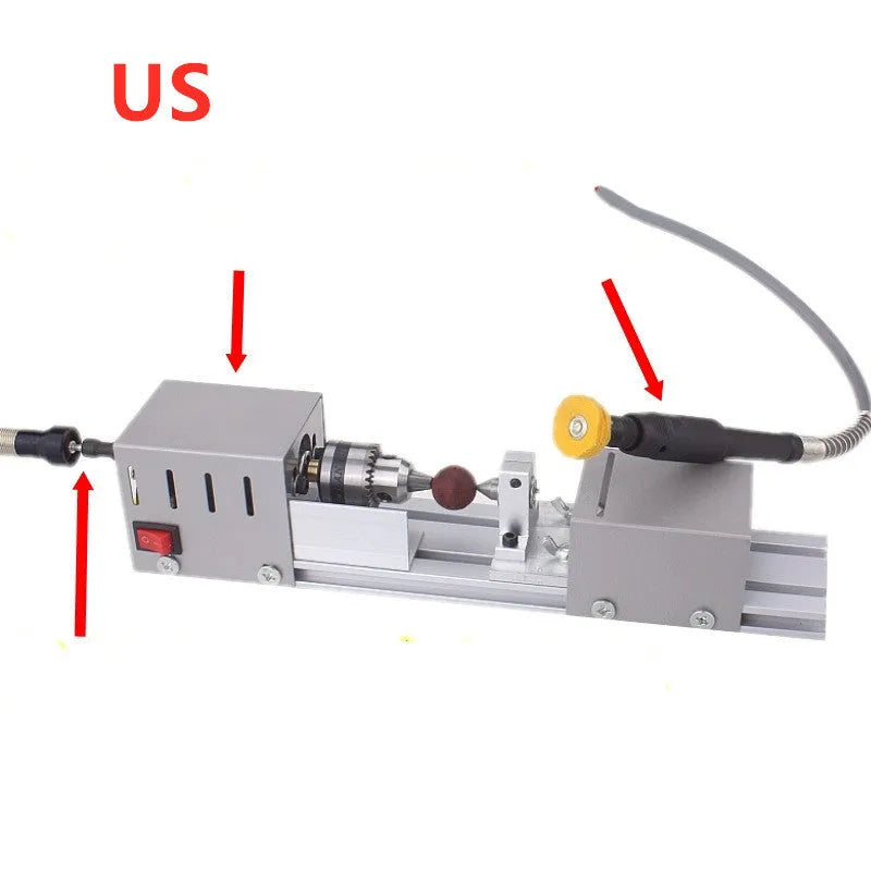 Mini silver metal manual woodworking lathe with carving knives on a workbench.