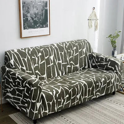 Geometric patterned stretch sofa slipcover fitted on a modern two-seater sofa.