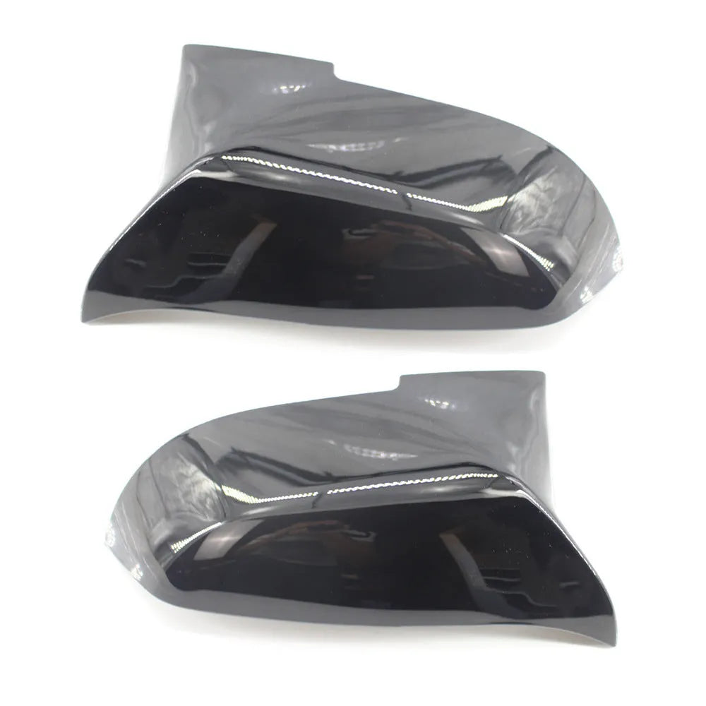 Pair of paint bright black BMW rear-view mirror replacement shells for 3 Series and 4 Series models.