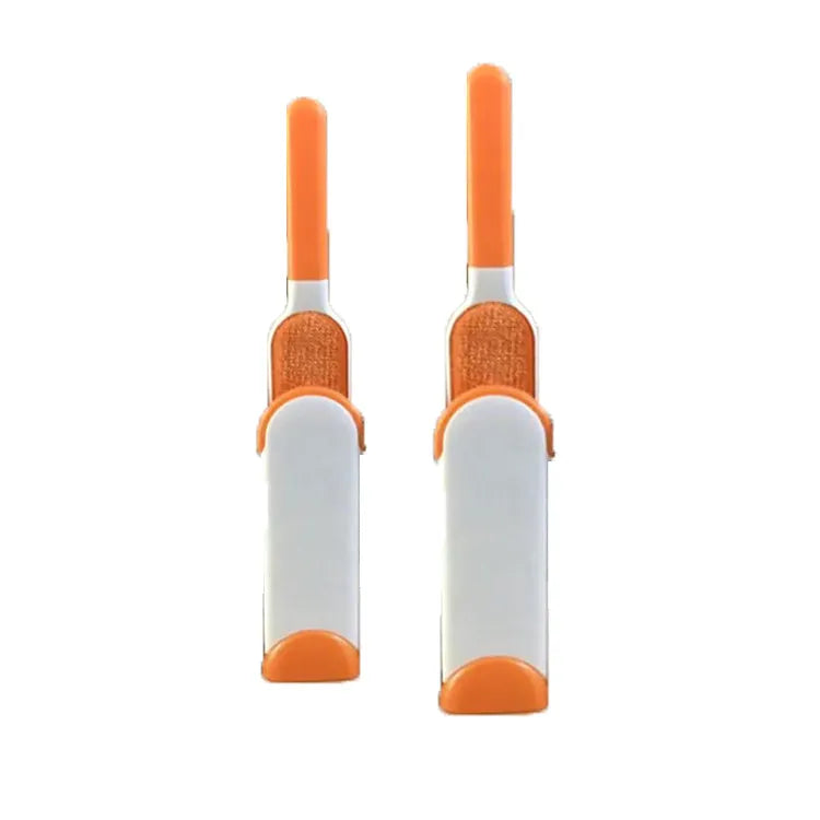 Blue reusable pet hair removal brush with a self-cleaning base, placed on a grey sofa.